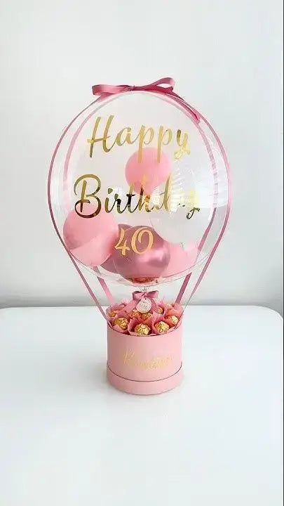 Bobo Balloon Basket – Happy Birthday Transparent Balloon Arrangement with Chocolates & Decorative Base