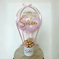 Bobo Balloon Basket – Happy Birthday Transparent Balloon Arrangement with Chocolates & Decorative Base